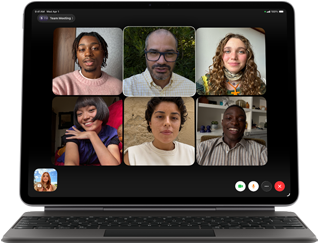 iPad Air, attached to Magic Keyboard, Black color, Group FaceTime call on screen